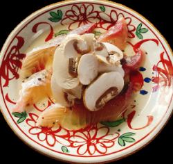 Domestic salmon served with mushrooms and flavored oil.