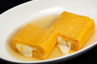 Freshly baked rolled omelet with mozzarella cheese, from the Sapporo area.