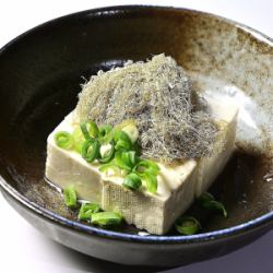 Homemade tofu topped with grated yam kelp