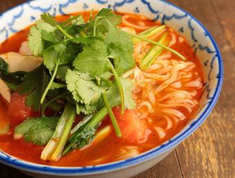 Sweet and spicy tom yum kung noodle Siam laksa with shrimp, tomato, and king king mushroom