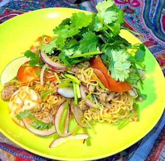 Addictive Thai national dish yum mama salad noodles with shrimp and tomato