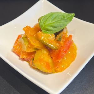 Chilled summer vegetables stewed in tomato sauce