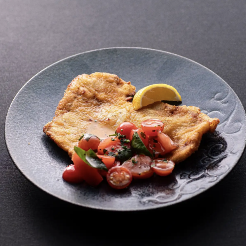 Milanese-style cutlet marinated in salt koji and checca sauce