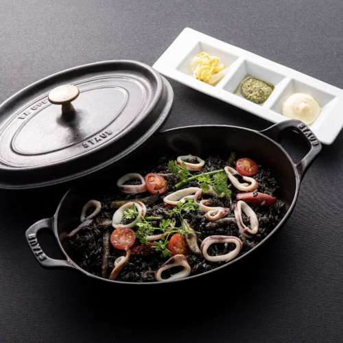 Our specialty! Black squid ink rizo pilaf cooked in an iron pot and oven