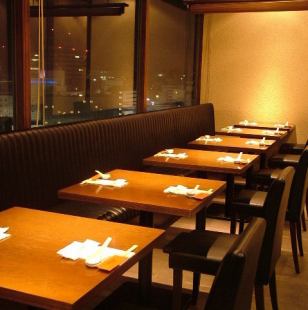 Table seat with a panoramic view of the night.There is a partition.