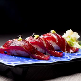 3 pieces of nigiri sushi with pickled tuna