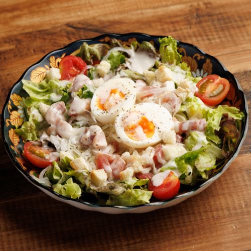 Caesar salad with soft-boiled egg and pancetta