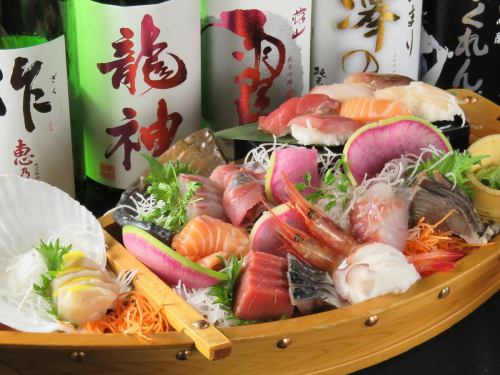 With nigiri sushi! Gorgeous! 10 fresh fish sashimi in a boat!