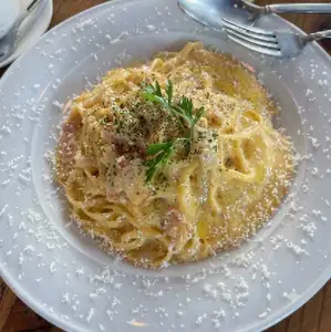 Rich carbonara with soft-boiled egg and bacon