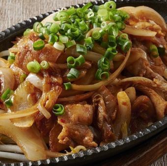 Stir-fried pork kimchi on an iron plate