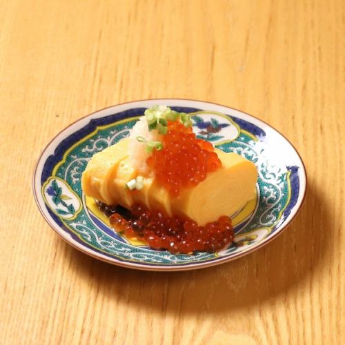 Rolled egg with dashi broth and grated salmon roe