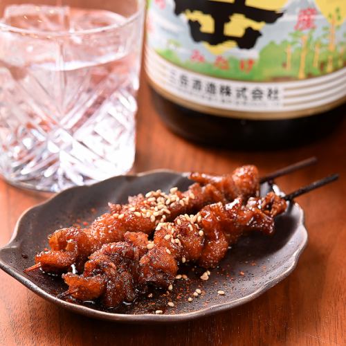 Chicken skin skewers grilled with sauce