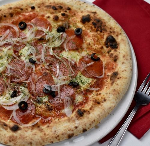 Authentic Neapolitan pizza baked in a large wood-fired oven