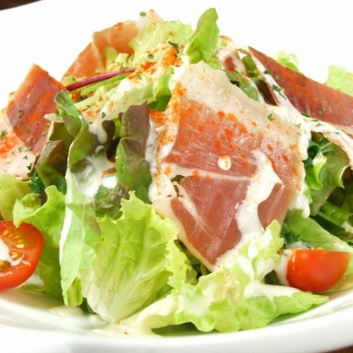 Caesar salad with prosciutto jamon serrano