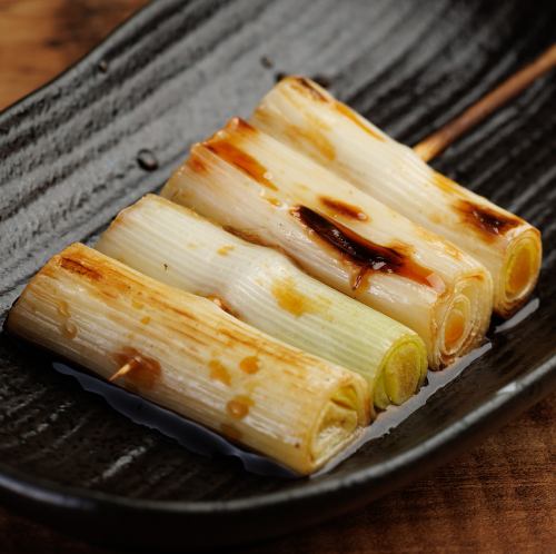 Grilled green onion skewers