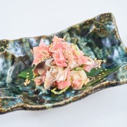 Fatty tuna marinated mackerel dressed with sweet pickled ginger and aromatic vegetables