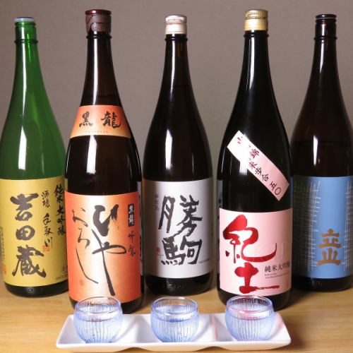 A lot of local sake selected carefully on the ground!