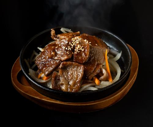 Wagyu beef off-cuts on a hot plate