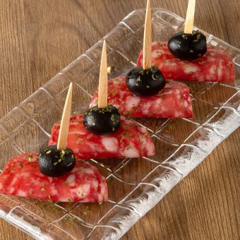 Pintxos with smoked cheese and Iberico salami