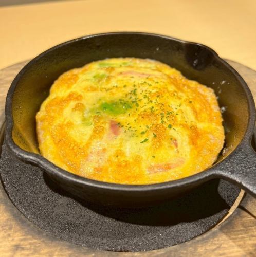 Omelette with seasonal ingredients and bacon