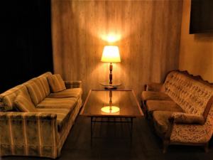 We have seats where you can relax comfortably on a soft antique sofa.