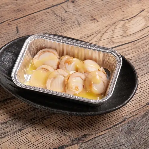 Scallops baked in foil with garlic butter