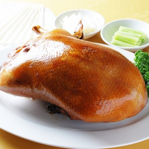 Peking duck with chili bean paste, cucumber, and green onion