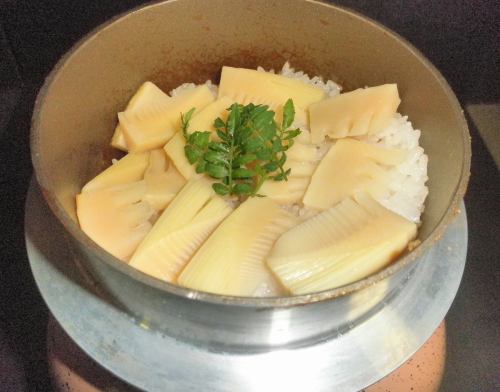 This time, it's "Rice cooked in a pot with fresh bamboo shoots."
