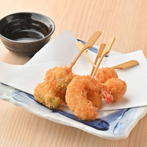 Assorted fried seafood skewers