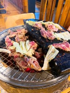 - 当店の名物にんにくスタミナ爆弾じん.焼 -