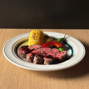 Beef rump steak served with seasonal vegetables