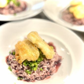 Black rice risotto with conger eel frit