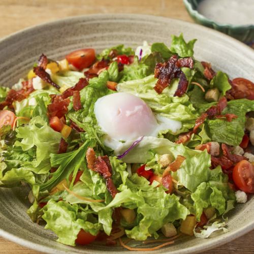 Soft-boiled egg and bacon Caesar salad