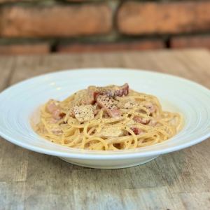 Pasta with fresh bacon and Italian porcini mushrooms in cream sauce