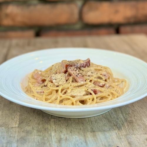 Pasta with fresh bacon and Italian porcini mushrooms in cream sauce