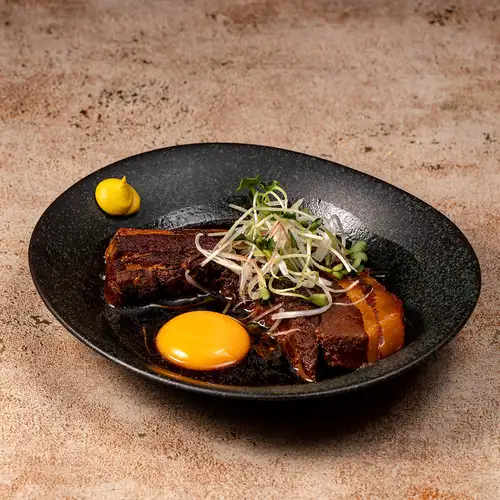 Tender braised pork belly