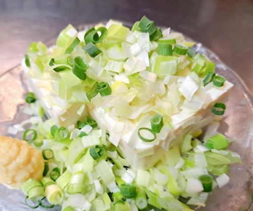 Cold tofu topped with lots of green onions