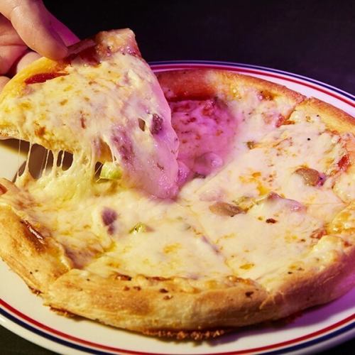 Old-fashioned mixed pizza with lots of cheese