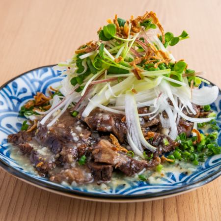 Beef tongue covered in green onions