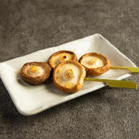 Shiitake mushroom skewers with butter and soy sauce