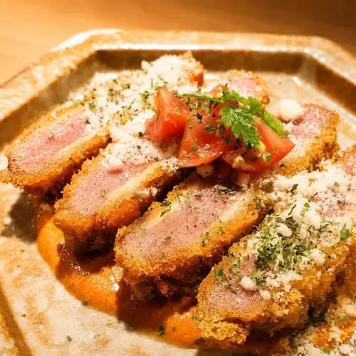 Ham cutlet with shrimp and tomato cream sauce