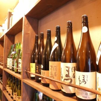 Seasonal sake is lining up with the slurry on the shelf before the counter.