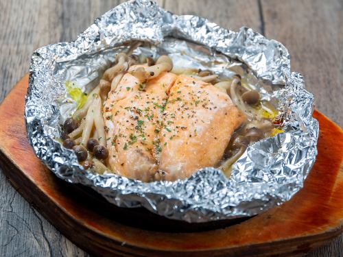 Grilled salmon and mushrooms in foil