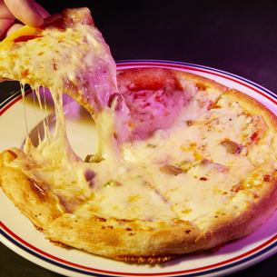 Old-fashioned mixed pizza with plenty of cheese