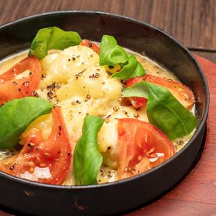 Tomato Caprese-style steamy potato salad