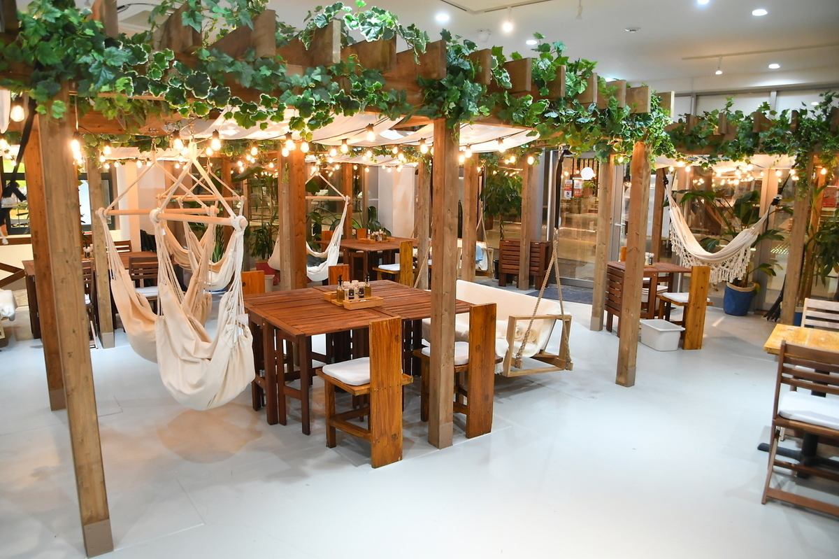 A resort-style garden restaurant featuring hammocks.