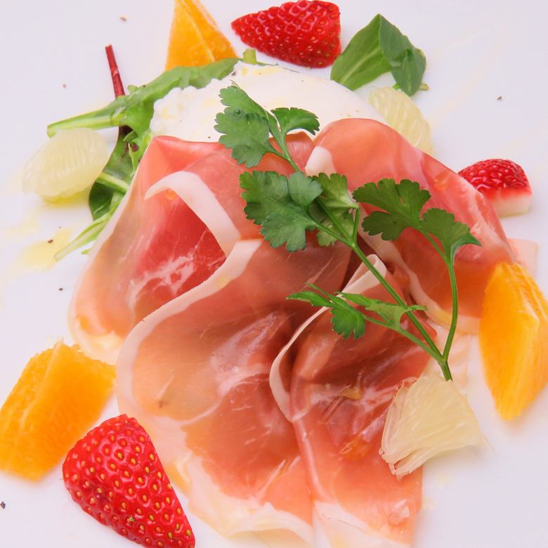 Appetizer of raw ham and raw mozzarella cheese