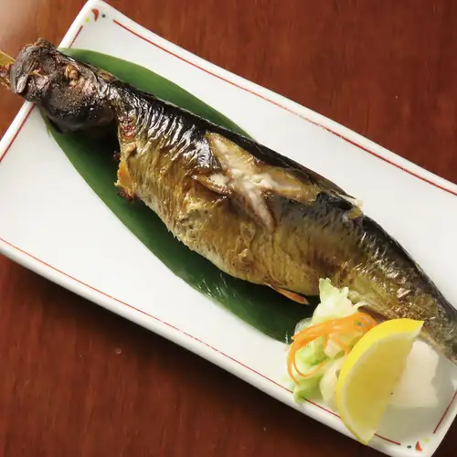 Whole dried herring grilled