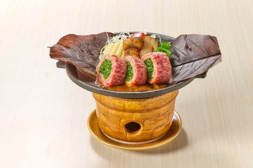 Matsutake mushroom and Wagyu beef grilled on a magnolia leaf