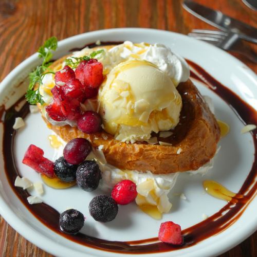 French toast topped with vanilla ice cream drizzled with honey